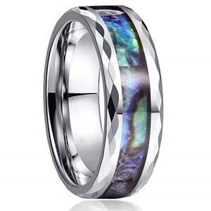 Detail of silver stainless steel ring with faceted surface and abalone shell inlay