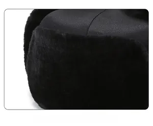 Close-up of thick faux fur lining and windproof fabric on black thermal trapper hat