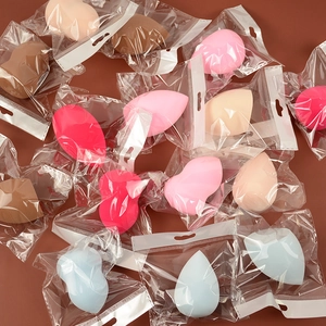 Macro shot of colorful beauty sponges in individual clear plastic packaging bags