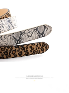 Detailed view of women's leather belts featuring faux snakeskin and leopard animal patterns