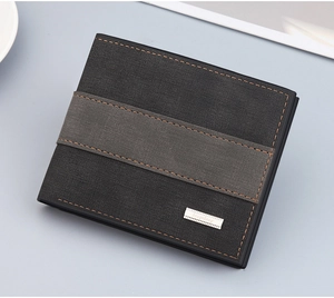 Close-up of men's bifold wallet with black lychee grain leather and orange stitching