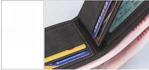 Detail of dark grey textured men's wallet featuring card slots and orange stitching