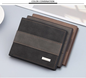 Close-up of vintage leather wallet texture with contrast stitching and metal logo