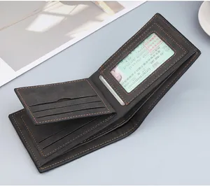 Interior detail of a black bifold wallet featuring orange stitching and multiple card slots