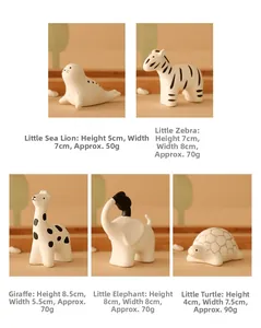 Detailed view of ceramic animal figurines showing dimensions for sea lion and zebra