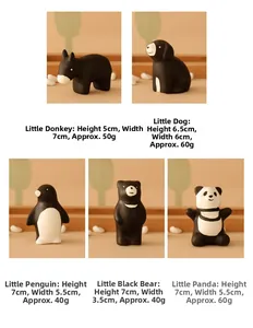 Detail showing various animal ceramic figurines including dog and panda on wooden stands