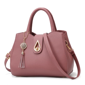 Dusty rose lychee grain tote bag with top handle and metallic water drop twist lock