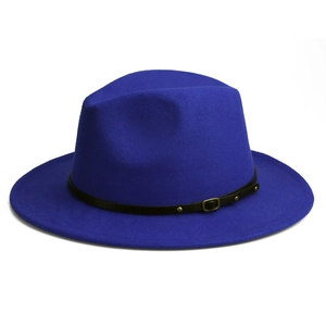 Detail of royal blue fedora hat with a black leather buckle strap and gold studs