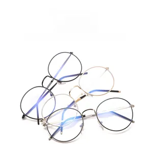 Macro shot of assorted blue light blocking round metal glasses in various finishes
