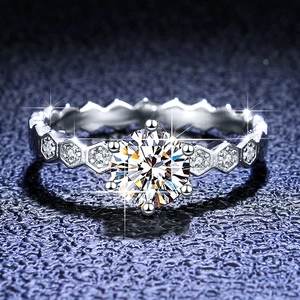 Macro shot of 1ct moissanite ring featuring a six-prong setting and honeycomb band design