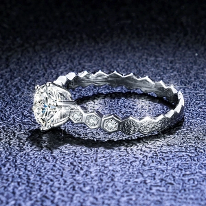 Macro shot of 1ct moissanite ring featuring a unique S925 silver honeycomb band design