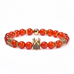 8mm red agate beaded bracelet with a gold crown charm and zircon accents on white background
