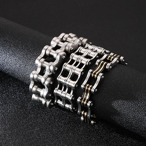 Men's stainless steel bicycle chain bracelets in silver and black on display stands