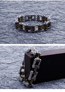 Detail of tricolor stainless steel motorcycle chain bracelet in silver, black and gold finish