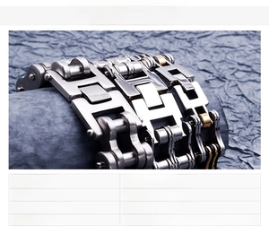 Detailed view of heavy stainless steel motorcycle chain bracelets in silver and gold tone