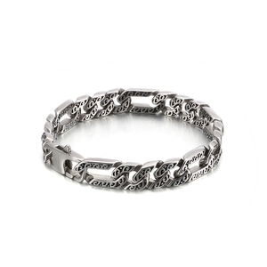 Men's silver stainless steel Cuban link bracelet with engraved patterns on white background
