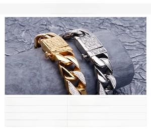 Detailed close-up of heavy cuban chain bracelet in gold and silver with lion head clasp
