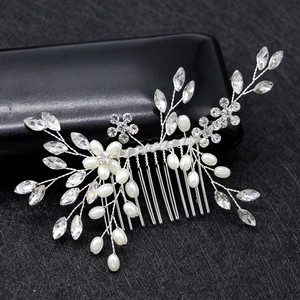 Detailed view of handmade silver bridal hair comb with pearls and clear crystal flowers