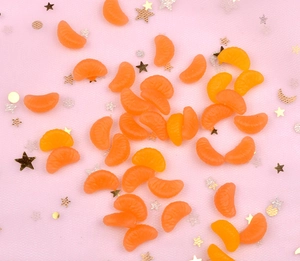 Macro detail of translucent orange resin orange slices with realistic pulp texture