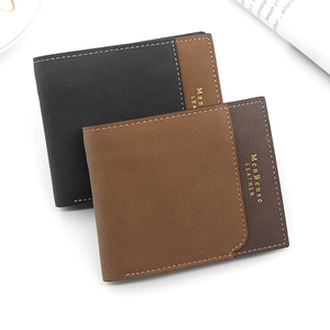 Detail of bifold leather men's wallets with contrast stitching and matte finish
