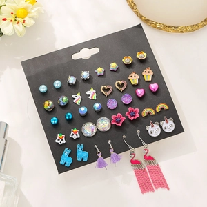 Cute fashion earring set with zircon hearts and flowers displayed on black card paper