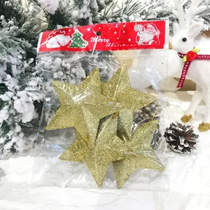 Glittering gold star Christmas tree ornaments in festive Merry Christmas packaging