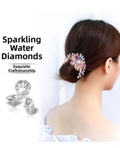 Close-up of a floral rhinestone hair comb featuring multicolor crystals on a bun