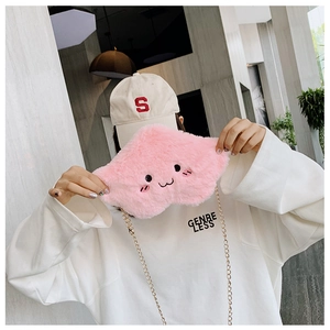 Detail of pink plush cloud bag with cartoon embroidery and gold chain strap
