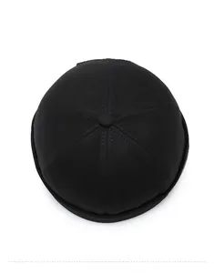 Top view of black cotton docker hat showing six-panel stitching and central button detail