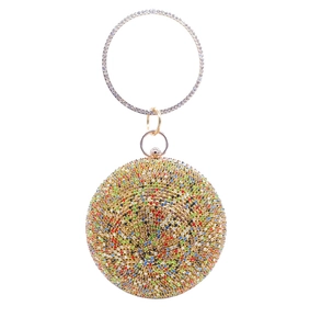 Close-up of a spherical evening clutch bag encrusted with colorful rhinestones and ring handle