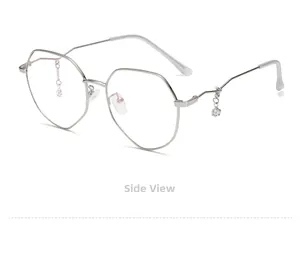 Detail view showing star pendant ornament on silver polygonal metal eyeglass frame