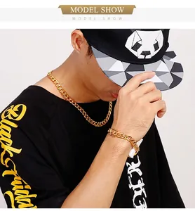 Detail of male model wearing gold-plated Cuban link necklace and matching bracelet set