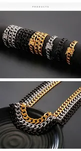 Detail of Cuban chain link with lion head carving in gold, silver and black finishes