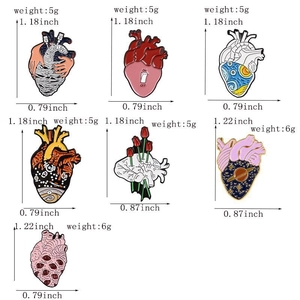 Detailed size chart and weight of anatomical heart enamel pins with star and flower motifs