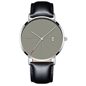 Macro detail of men's business watch featuring a grey sunburst dial and calendar window