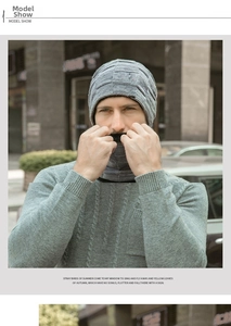 Detail of grey knitted beanie and neck warmer set with textured square grid pattern