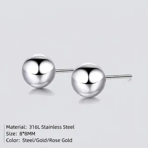 Minimalist 8mm spherical stud earrings in 316L stainless steel available in gold and rose gold