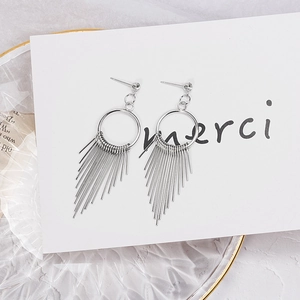 Silver geometric tassel earrings with rhinestones in a long bohemian style on white card