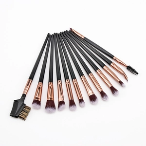 Close-up of 12-piece professional makeup brush set with black handles and rose gold ferrules