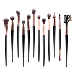 Detail shot of 12 professional makeup brushes with rose gold ferrules and black handles