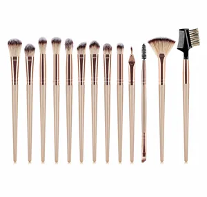 Detail showing 13 champagne gold makeup brushes with rose gold ferrules and soft bristles
