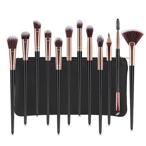 Detail of 12pcs professional makeup brush set with rose gold ferrules and leather pouch