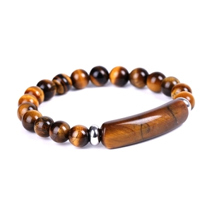 Detailed close-up of tiger eye stone bracelet with golden brown beads and silver spacers