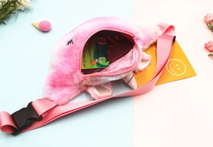 Detailed view of pink plush unicorn waist bag showing internal space for cards and passport