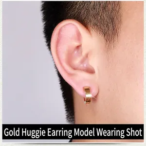 Polished gold stainless steel hoop earring shown on a male model for a minimalist punk look