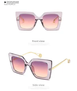Detail of cat-eye sunglasses with purple gradient lenses and slim gold metal temples