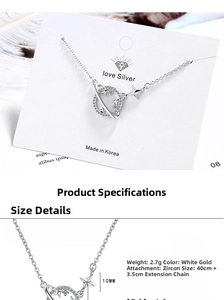 Detailed view of silver planet pendant with Saturn ring and cubic zirconia stones