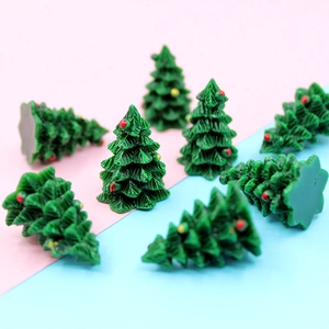 Detailed view of miniature 3D resin Christmas trees with colorful ornaments for DIY crafts