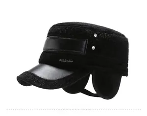 Detail view of winter men's faux mink fur cap with ear flaps and metal rivet accents