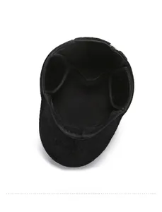 Detail of warm black winter hat featuring thick faux fur lining and ear protection flaps